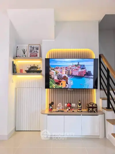 Modern living room with stylish TV setup and ambient lighting