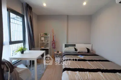 Cozy modern bedroom with natural light and stylish decor