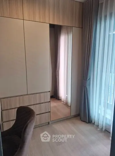 Modern bedroom with elegant wardrobe and natural light