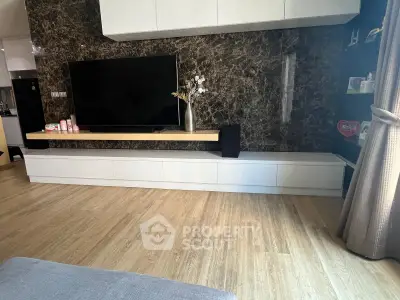 Modern living room with sleek TV unit and elegant decor