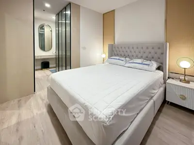 Modern bedroom with elegant decor and plush bed in a stylish apartment