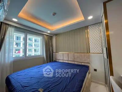 Luxurious bedroom with modern design and large window in high-rise apartment