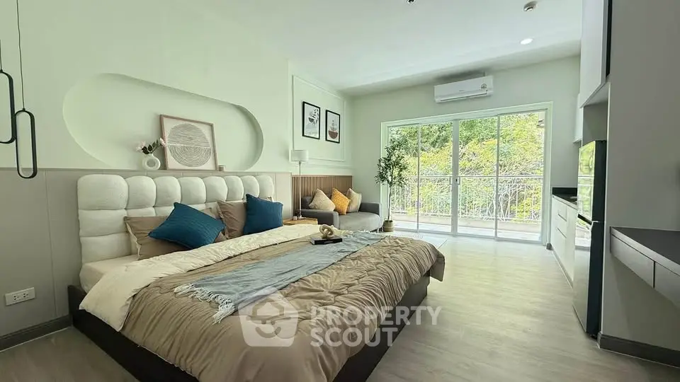 Spacious modern bedroom with large windows and stylish decor