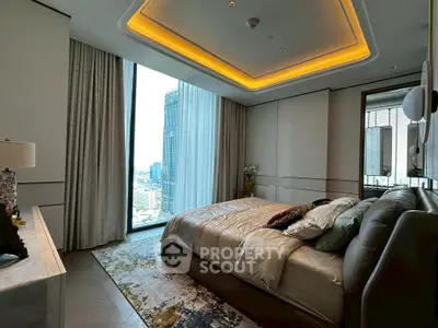 Luxurious bedroom with city view, modern lighting, and elegant decor in high-rise apartment.