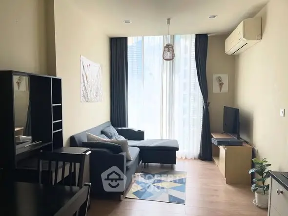 Modern living room with stylish furniture and large window view