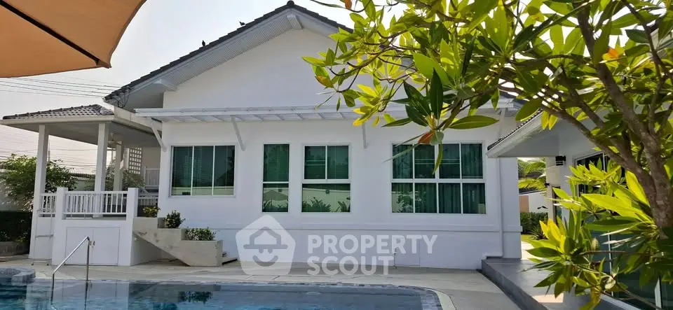 Charming suburban home with pool and lush greenery, perfect for family living.