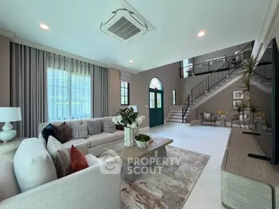 Spacious modern living room with elegant decor and high ceilings