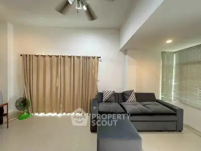 Spacious living room with modern sofa and natural light