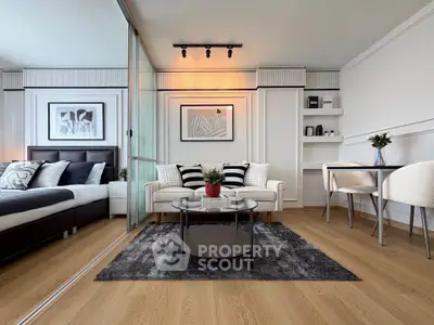 Modern living room with stylish decor, cozy seating, and elegant artwork, perfect for relaxation and entertaining.