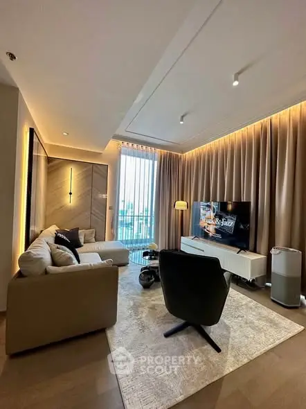 Luxurious modern living room with elegant decor and large windows offering natural light.