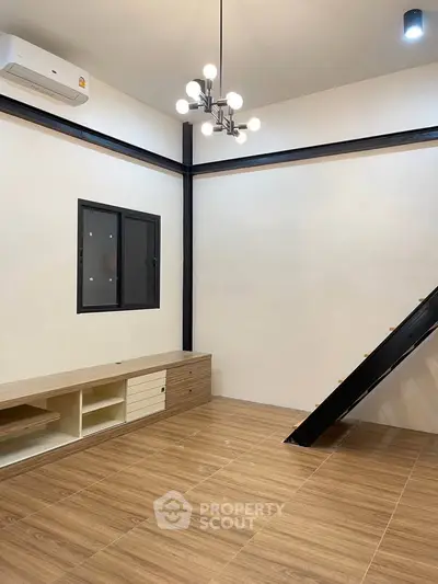 Modern living room with wooden flooring and stylish lighting