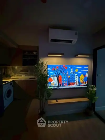 Modern living room with wall-mounted TV, air conditioning, and stylish decor in a cozy apartment.