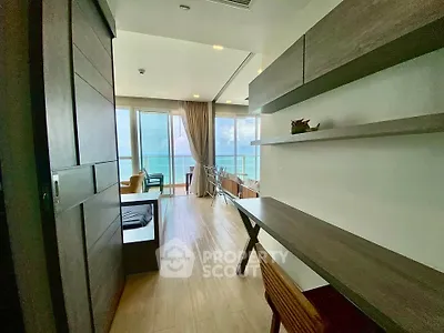 Modern living room with ocean view and sleek wooden furniture
