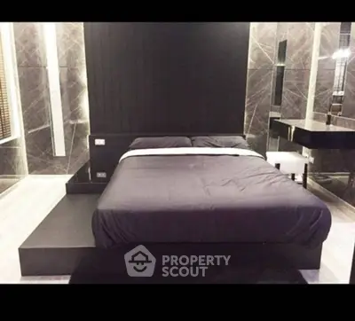 Luxurious modern bedroom with sleek black and marble design