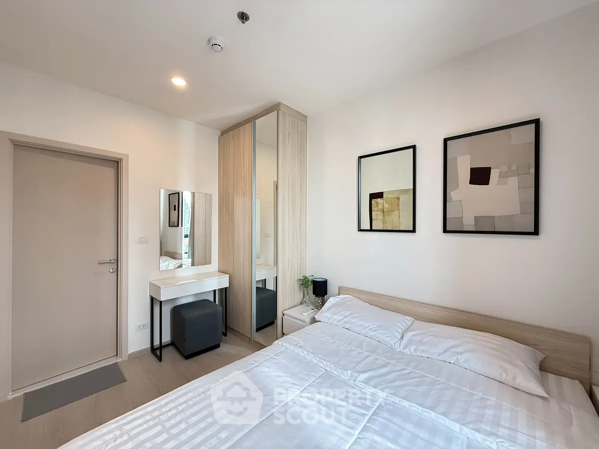 Modern bedroom with stylish decor and ample natural light