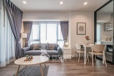 Modern living room with stylish decor and natural light in a cozy apartment.