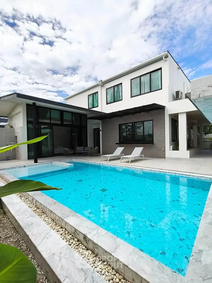 Luxurious modern villa with private pool and stunning architecture under a clear blue sky.