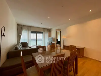 Spacious living room with modern furniture and large windows for natural light.