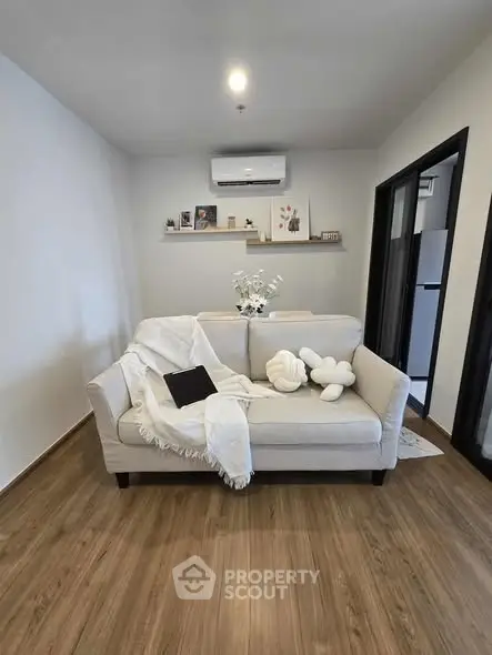 Cozy living room with stylish sofa and modern decor, perfect for relaxation and comfort.