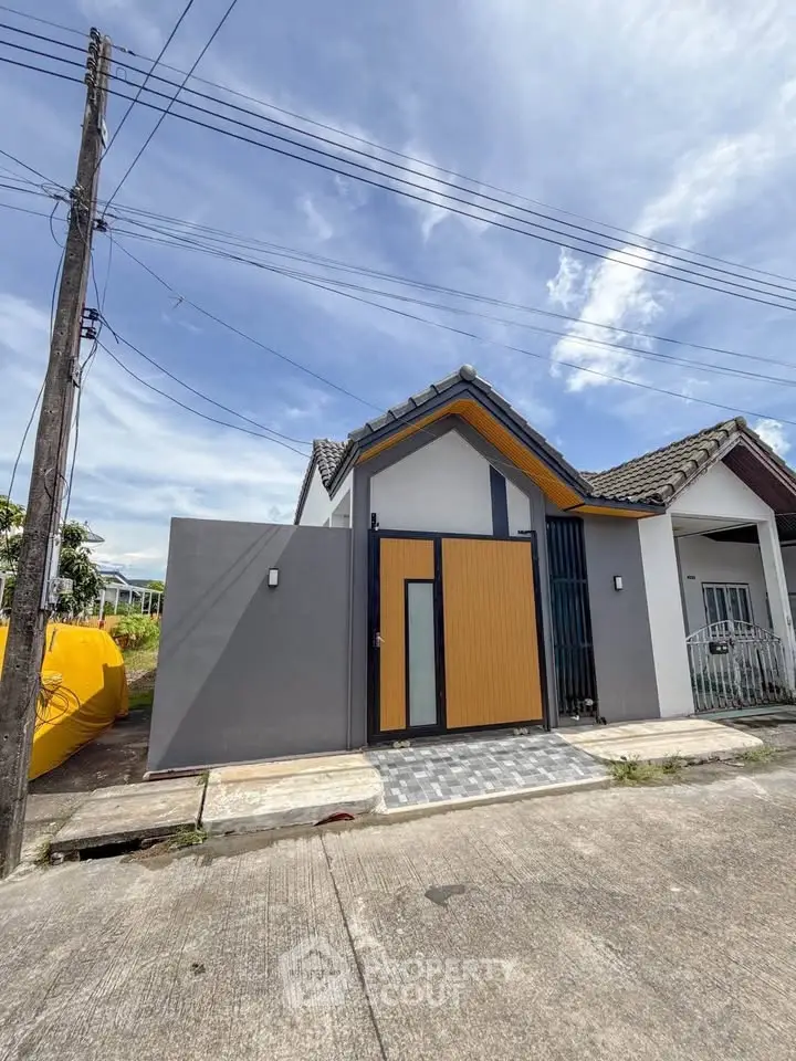 Charming modern house exterior with unique design and vibrant colors, perfect for contemporary living.