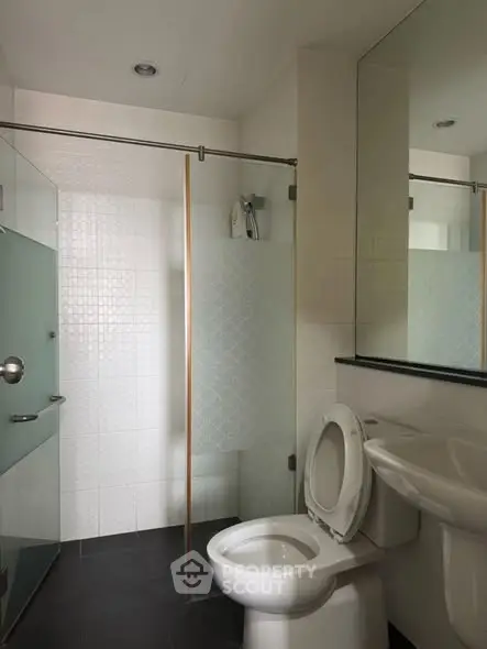 Modern bathroom with glass shower and sleek fixtures