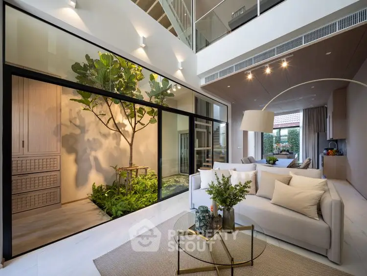 Luxurious modern living room with indoor garden and open layout