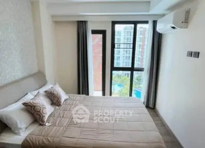 Modern bedroom with large window and air conditioning in a stylish apartment.