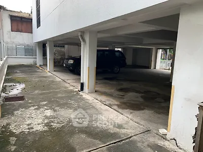 Covered parking area with ample space in residential building