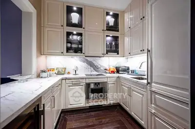 Luxurious modern kitchen with marble countertops and sleek cabinetry
