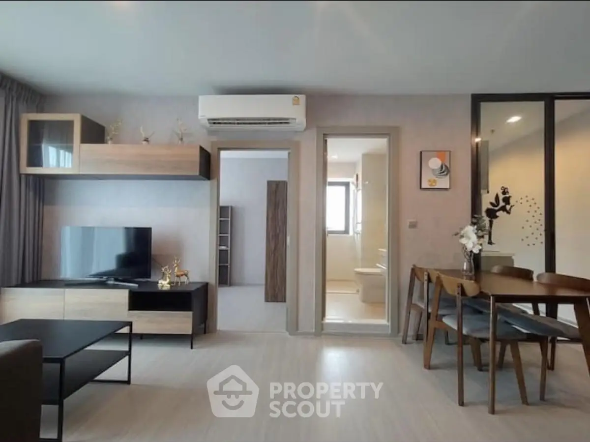 Modern living room with open dining area and stylish decor