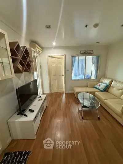 Cozy living room with modern decor and wooden flooring