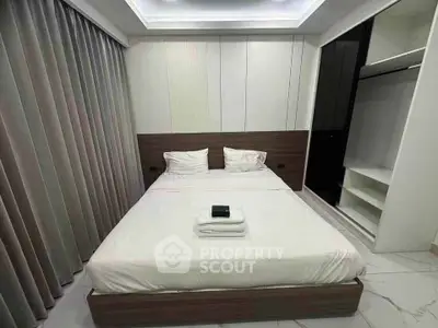 Modern bedroom with sleek design and ample storage space