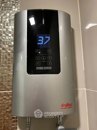 Modern bathroom with sleek water heater and digital temperature display