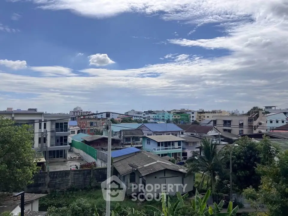 Scenic urban view with diverse residential buildings under a vibrant sky.