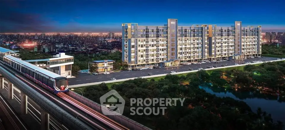 Modern condominium building with city skyline and train station access