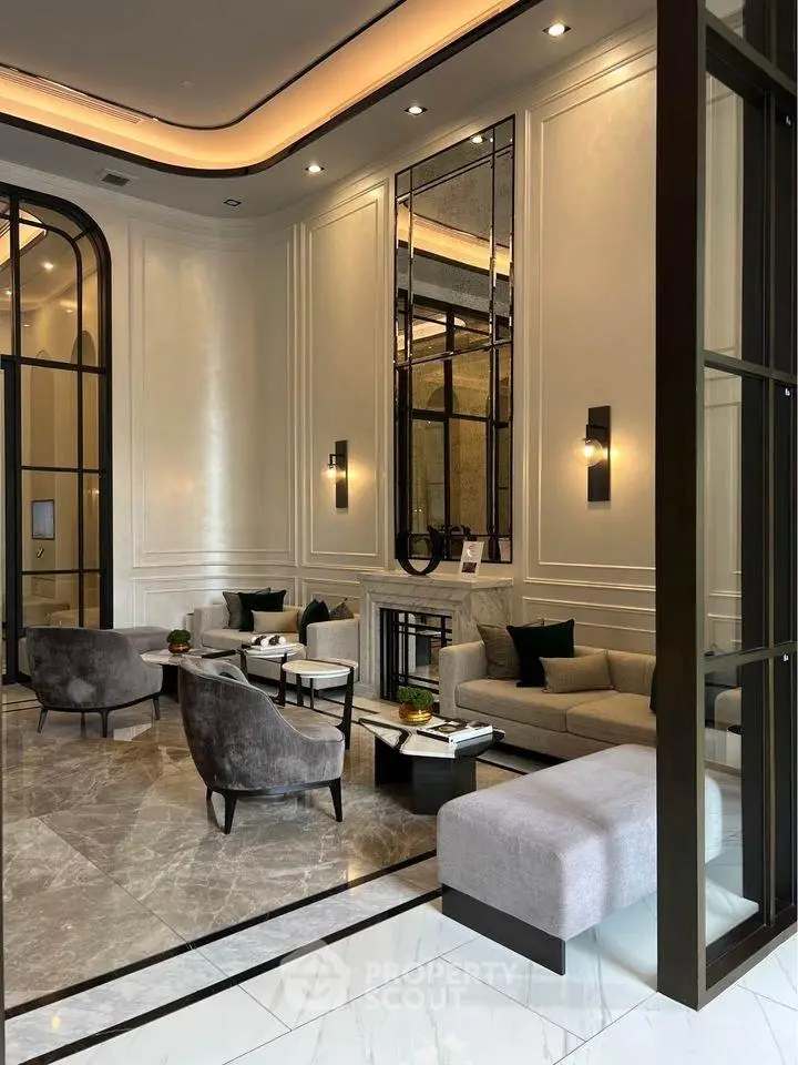 Luxurious modern lobby with elegant seating and marble flooring in upscale building.