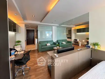 Spacious modern living room with stylish decor and open layout, featuring comfortable seating and elegant lighting.