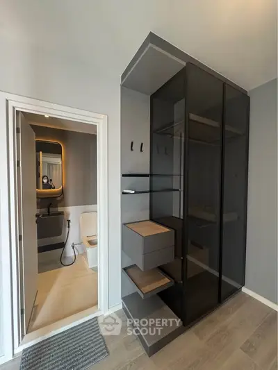 Modern bathroom with sleek glass shower and stylish storage unit