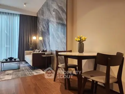 Modern living room with elegant decor, featuring a cozy sofa, stylish dining area, and floor-to-ceiling windows.