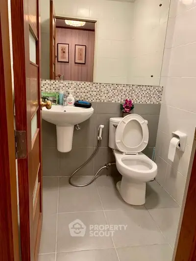 Modern bathroom with sleek fixtures and stylish tile accents