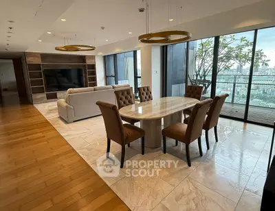 Luxurious open-plan living and dining area with stunning city views and elegant furnishings.