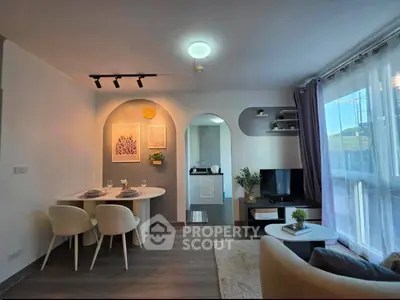 Modern living room with dining area and stylish decor in a bright apartment