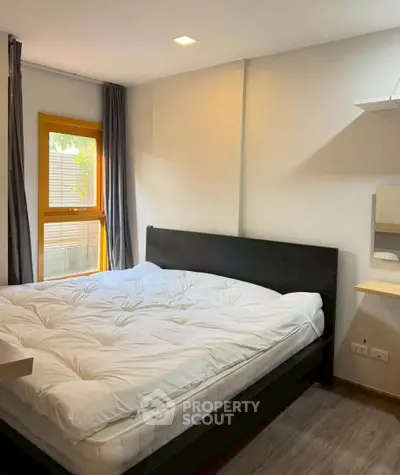 Cozy bedroom with modern decor and natural light