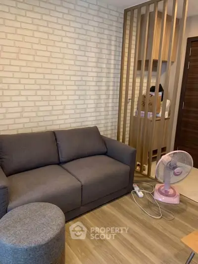 Cozy living room with modern gray sofa and stylish decor