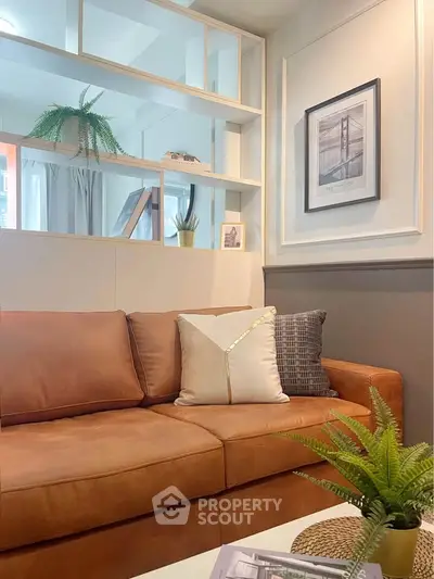 Stylish living room with modern decor and cozy brown sofa, perfect for relaxation and entertaining.