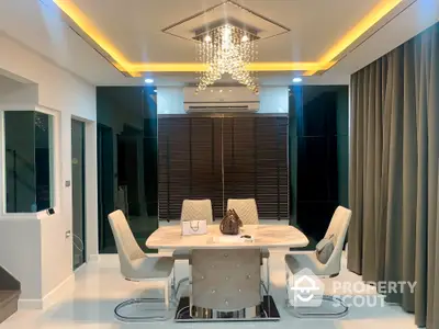 Elegant dining area with modern chandelier and stylish decor