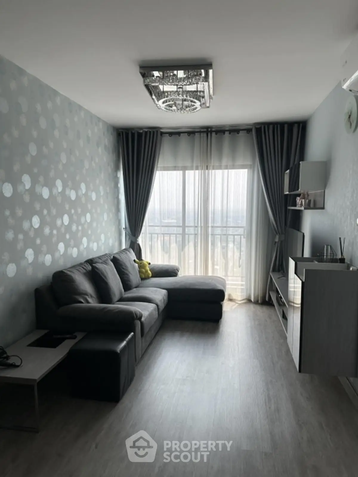 Modern living room with stylish decor and large window view