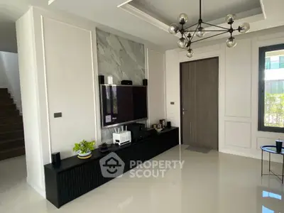 Modern living room with sleek TV setup and stylish lighting