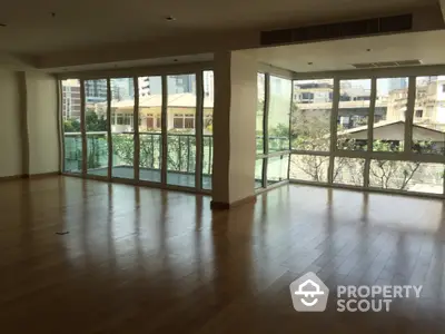 Spacious corner unit with large windows and city view, perfect for modern living.