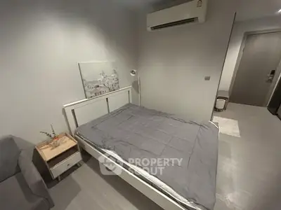 Modern bedroom with sleek design and air conditioning unit